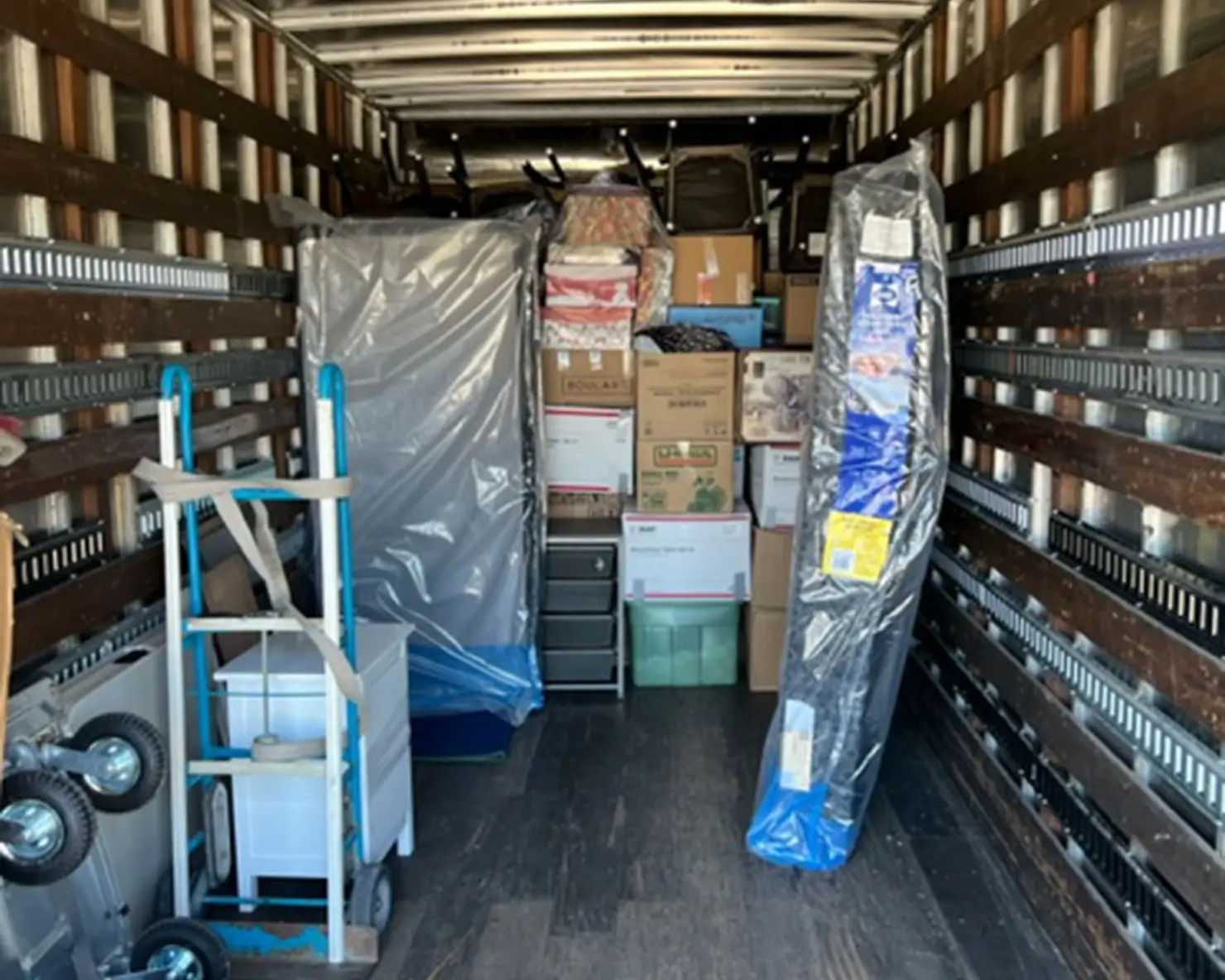 Anywhere Moving boxes and wrapped contents in truck